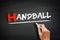 Hand writing Handball on blackboard, concept background