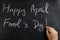 Hand writing Happy April fool s day blackboard chalkboard