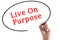 Hand writing Live On Purpose on transparent board