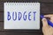 Hand writing on notepad: Budget