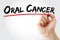 Hand writing Oral Cancer with marker, health concept background