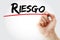 Hand writing Riesgo spanish words for Risk with marker, business concept