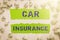 Hand writing sign Car Insurance. Internet Concept Accidents coverage Comprehensive Policy Motor Vehicle Guaranty