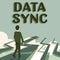 Hand writing sign Data Sync. Internet Concept data that is continuously generated by different sources