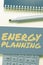 Hand writing sign Energy Planning. Word for making of a strategy and plan for the consumption of energy