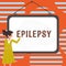 Hand writing sign Epilepsy. Business overview Fourth most common neurological disorder Unpredictable seizures