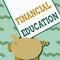 Hand writing sign Financial Education. Word Written on education and understanding of various financial areas Piggy Bank