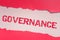 Hand writing sign Governance. Concept meaning exercised in handling an economic situation in a nation Replacing Old
