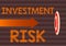 Hand writing sign Investment Risk. Business concept potential financial loss inherent in an investment decision