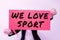 Hand writing sign We Love Sport. Business concept To like a lot practicing sports athletic activities work out