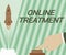 Hand writing sign Online Treatment. Word for providing mental health services over the internet Man Hand Pressing Button