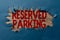 Hand writing sign Reserved Parking. Business approach parking spaces that are reserved for specific individuals