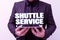 Hand writing sign Shuttle Service. Business overview vehicles like buses travel frequently between two places Presenting