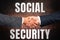 Hand writing sign Social Security. Business overview government system that provide monetary assistance to showing Two