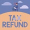 Hand writing sign Tax Refund. Business showcase refund on tax when the tax liability is less than the tax paid Man