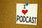 Hand writing text caption inspiration showing I Love Podcast concept meaning Internet Broadcasting Concept Loving written on stick