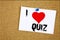 Hand writing text caption inspiration showing I Love Quiz concept meaning Test education Exam Concept Loving written on sticky not