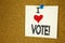 Hand writing text caption inspiration showing I Love Vote concept meaning Voting Electoral Vote Loving written on sticky note, rem