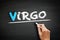 Hand writing Virgo on blackboard, concept background