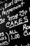 Hand written chalk menu board featured the word Cakes prominently