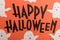 Hand written phrase Happy Halloween with ghosts near it