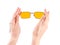 Hand with yellow glasses