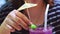 hand of young woman touching lime drinking cold purple cocktails refreshing water, food and drink for summer season