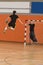Handball player jumping with the ball