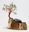 Handcrafted and painted wire tree attached to rock, pride rock