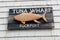 Handcrafted sign on weathered shingles of building, Rockport, Massachusetts, 2019