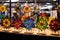 handcrafted stained glass suncatchers in holiday motifs at a booth