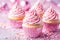 Handcrafted Vanilla Cupcakes Topped With Pink Frosting and Sprinkles