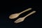 Handcrafted wooden kitchen utensils with a fork and spoon isolated