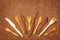 Handcrafted wooden utensils on leather background
