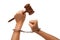 Handcuffed Woman Holding Wooden Gavel on White