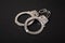 handcuffs on black background, concept arrest