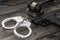 Handcuffs for detaining criminals, a judge`s hammer,