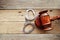 Handcuffs and judge gavel on wooden background suggesting starting a crime trial verdict