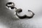 Handcuffs on stainless steel desk for business risk, still life