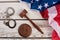 Handcuffs, wooden gavel and USA flag.