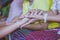 Handfasting. Selective focus on hands of Thai graduation ceremony.