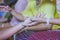 Handfasting. Selective focus on hands of Thai graduation ceremony.