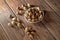 A handful of almonds with hazelnut on a wooden table