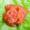 Handful of caviar of whitefish on green lettuce