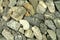 A handful of crushed gravel construction background