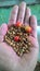 a handful of dried robusta coffee beans awaiting the roasting process at a coffee factory in Cililin on 18 July 2020