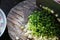 Handful of finely chopped green onions on striped wooden board