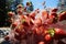 A handful of fresh selected chopped strawberries in a splash of water against a background of forest and blue sky.