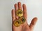 Handful of golden bitcoin coins in top view showing the earned cryptocurrency and offering to do transactions in global trade