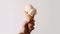 A Handful of Happiness, A Mans Hand Holding a Delicious Scoop of Milk Ice Cream on a Crispy Waffle Cone. Generative AI